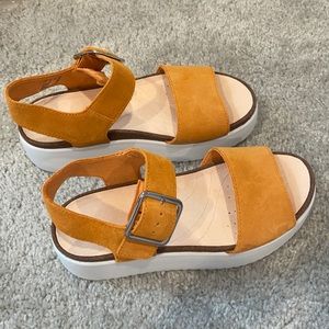 Mustard Clark’s sandals. Brand new